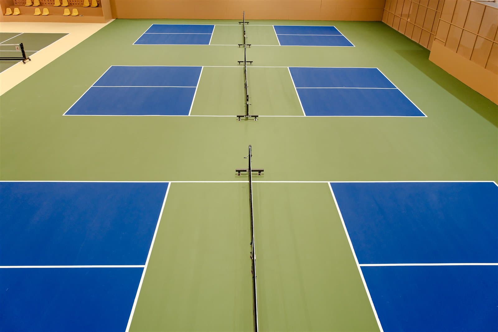 Rows of indoor pickleball courts at Pickleland