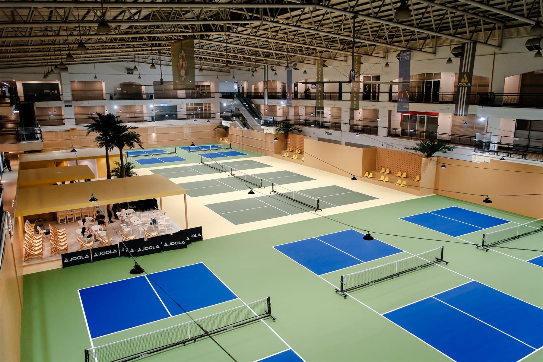 Elevated view of Pickleland's nine indoor courts, lounge, and pro shop under one roof